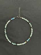 Full view of 15-inch aquamarine, turquoise, blue apatite and black onyx choker with silver accents