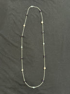 Full view of long silver-tone chain necklace with spaced aquamarine, amethyst and porcelain jasper stones