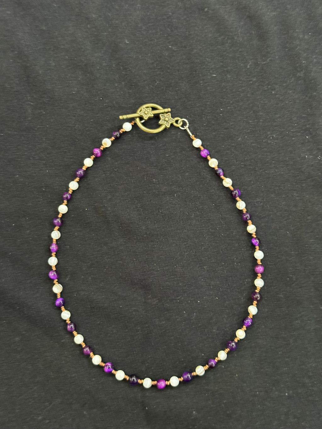 Full view of purple tiger’s eye, mother of pearl and copper beaded choker necklace