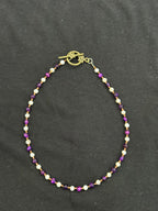 Full view of purple tiger’s eye, mother of pearl and copper beaded choker necklace