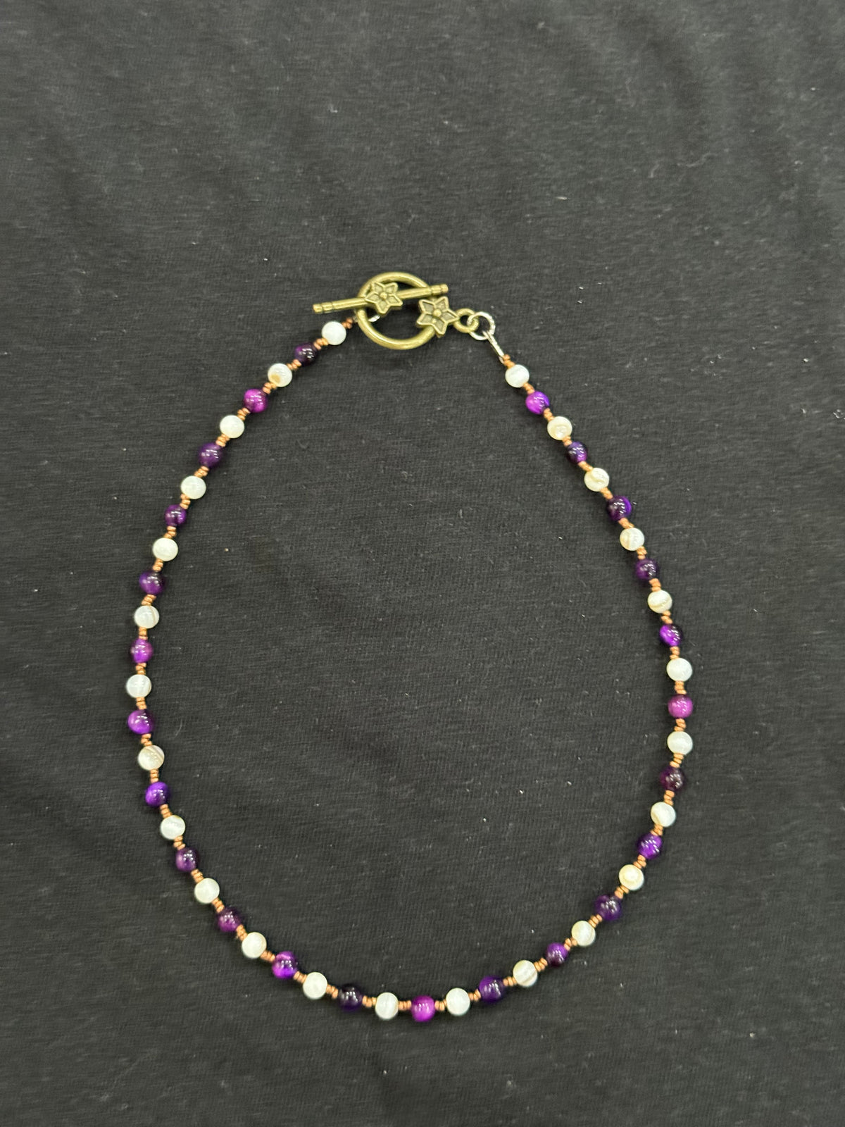 Full view of purple tiger’s eye, mother of pearl and copper beaded choker necklace