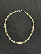 Full view of tourmaline and cultured pink pearl choker with imitation silver accents and stainless steel clasp