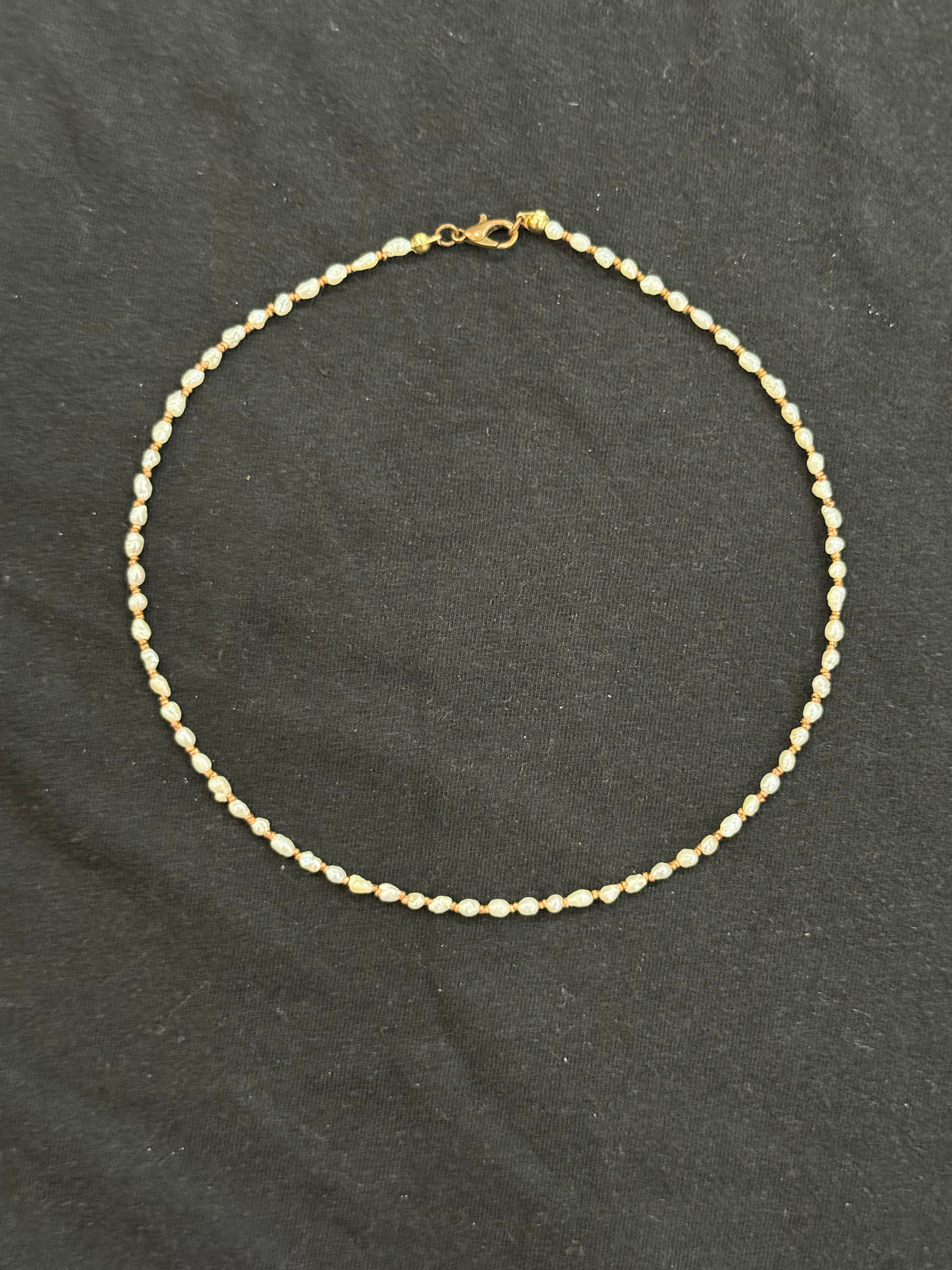 Full view of 2mm uncultured pearl and copper bead choker necklace
