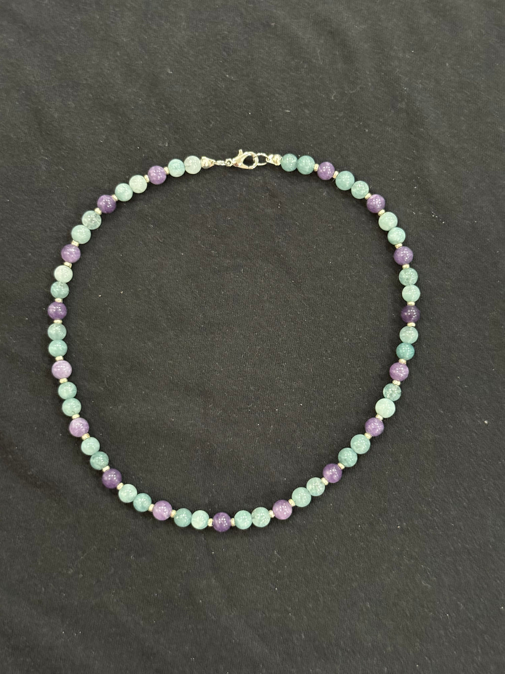Full view of aquamarine and purple chalcedony necklace with silver accents