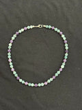 Full view of aquamarine and purple chalcedony necklace with silver accents