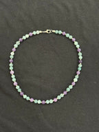 Full view of aquamarine and purple chalcedony necklace with silver accents