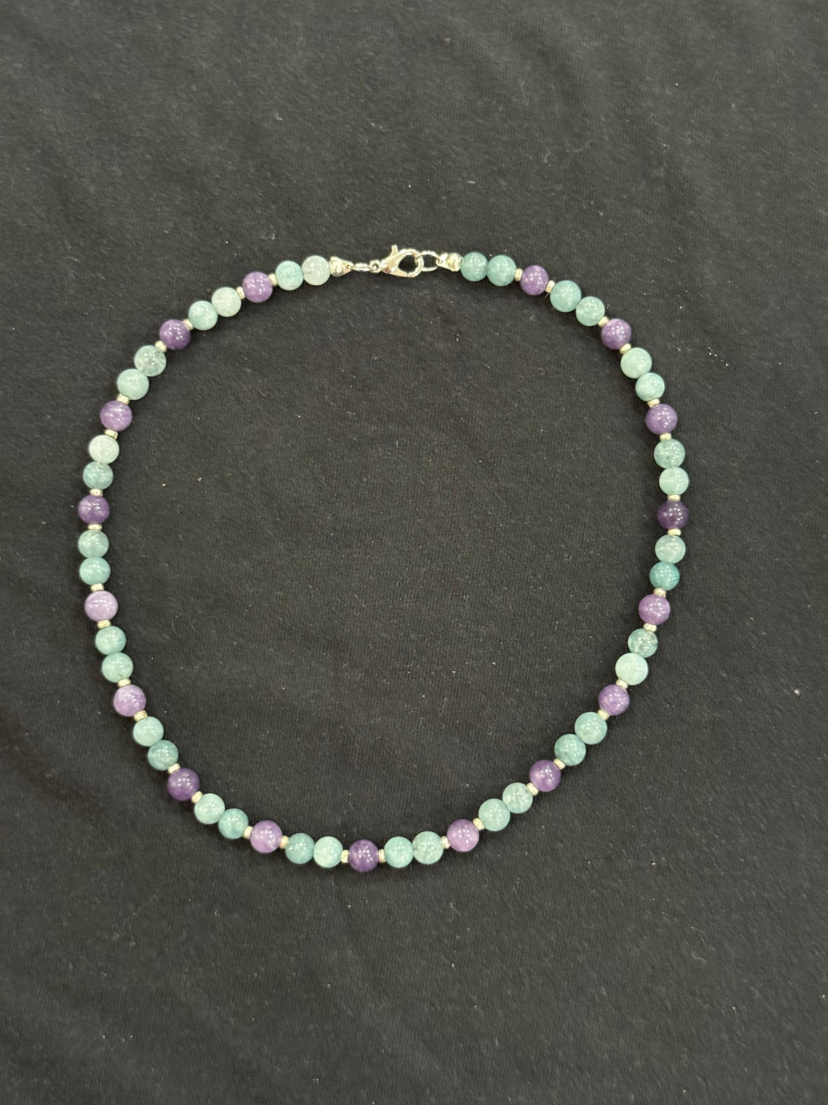 Full view of aquamarine and purple chalcedony necklace with silver accents