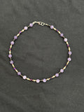 Full view of lavender chalcedony and onyx choker with white pearls and copper accents