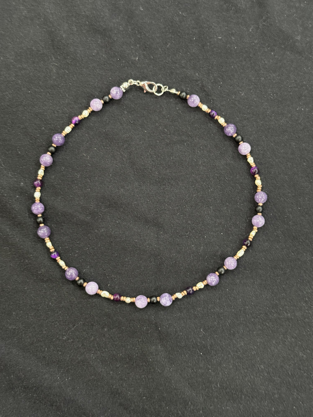 Full view of lavender chalcedony and onyx choker with white pearls and copper accents