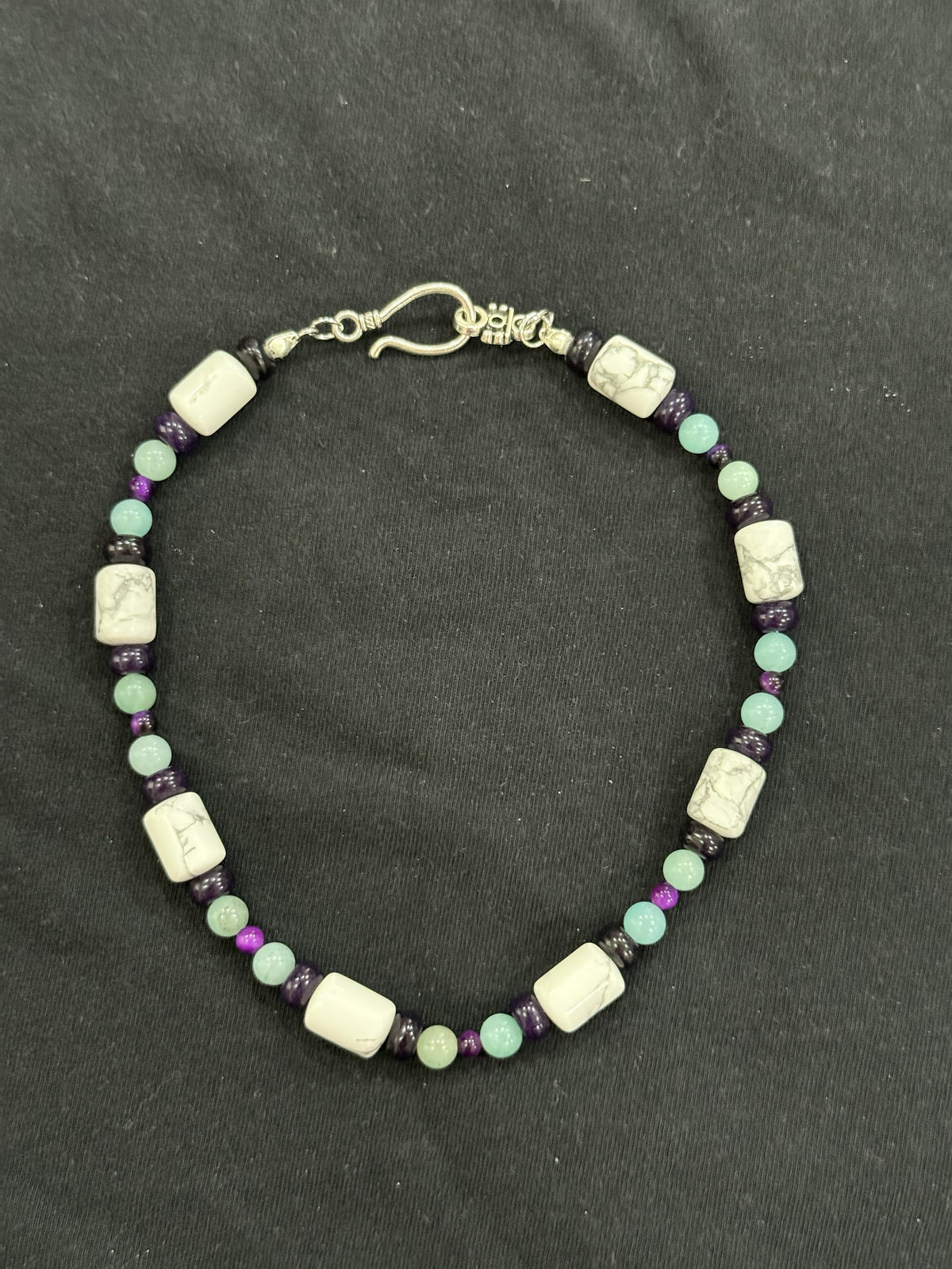 Full view of white howlite, amethyst, amazonite and purple tiger’s eye choker
