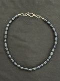 Full view of blue uncultured pearl necklace with silver hook clasp