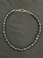 Full view of blue uncultured pearl necklace with silver hook clasp