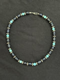Full view of blue uncultured pearl and turquoise necklace with imitation silver accents