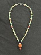 Full view of amazonite necklace with porcelain jasper and mookaite accents and a gemstone pendant