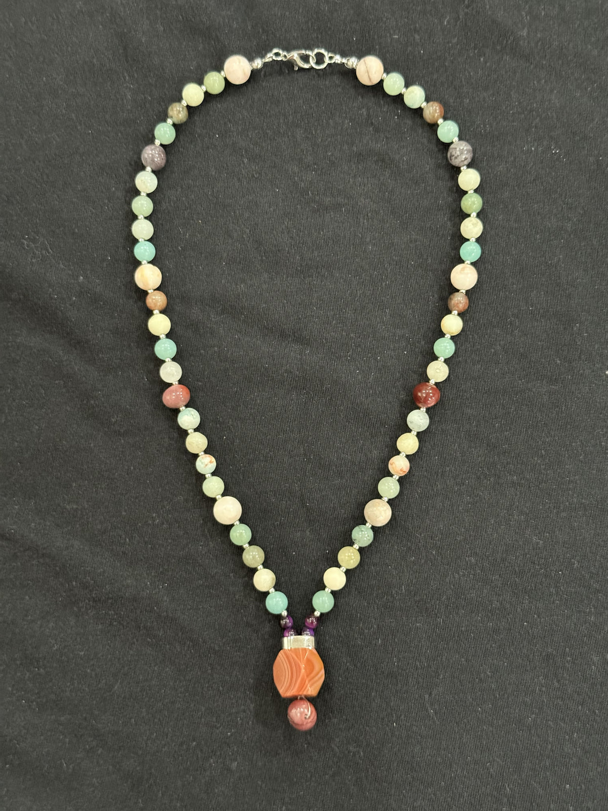 Full view of amazonite necklace with porcelain jasper and mookaite accents and a gemstone pendant