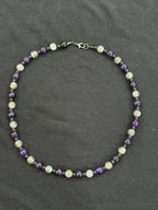 Full view of lepidolite and purple tiger’s eye necklace with black onyx accent beads