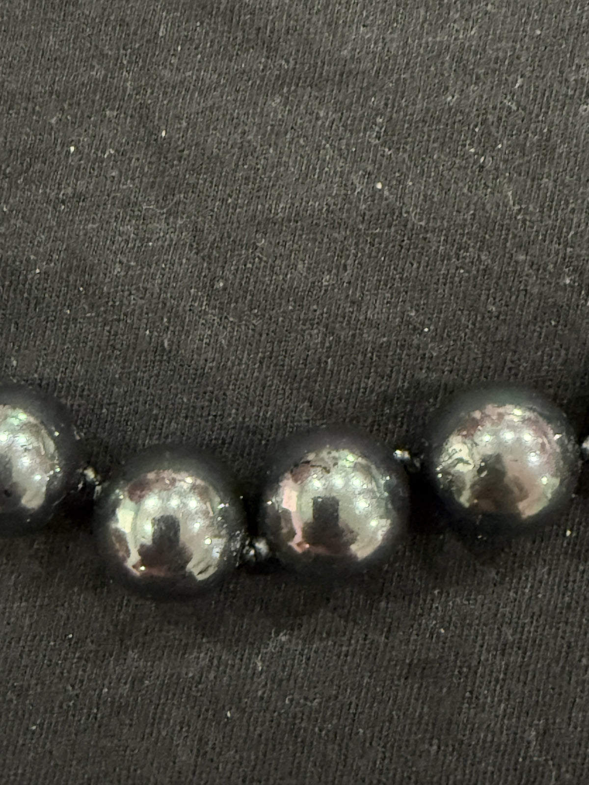 Full view of Tahitian cultured pearl necklace on knotted leather with adjustable clasp and chain